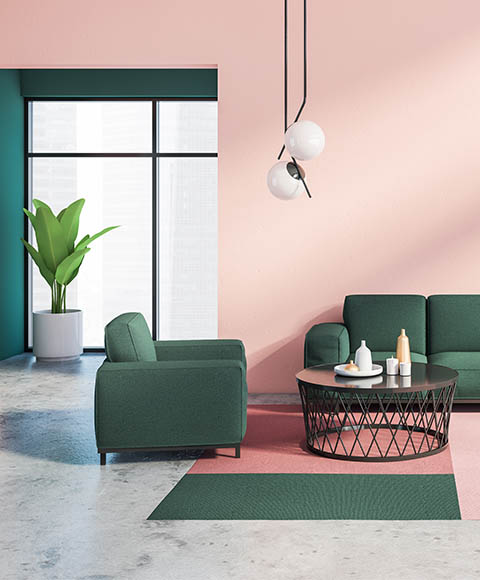 Modern clean living room with salmon pink walls and green sofa